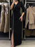 Vestido Negro Largo con Detalles de Flecos y Broche Elegante